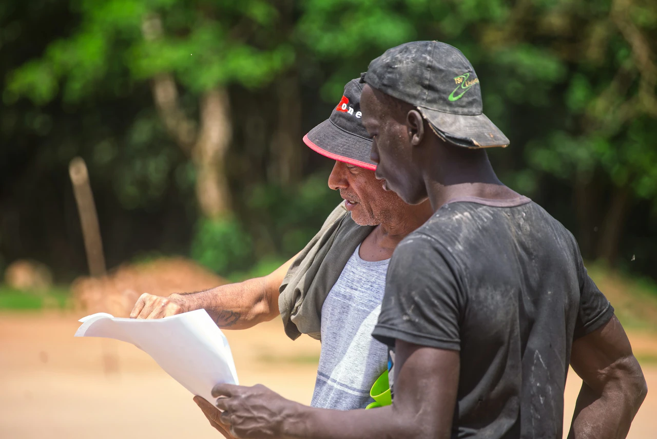 People reviewing information in a meeting, illustrating accountability.