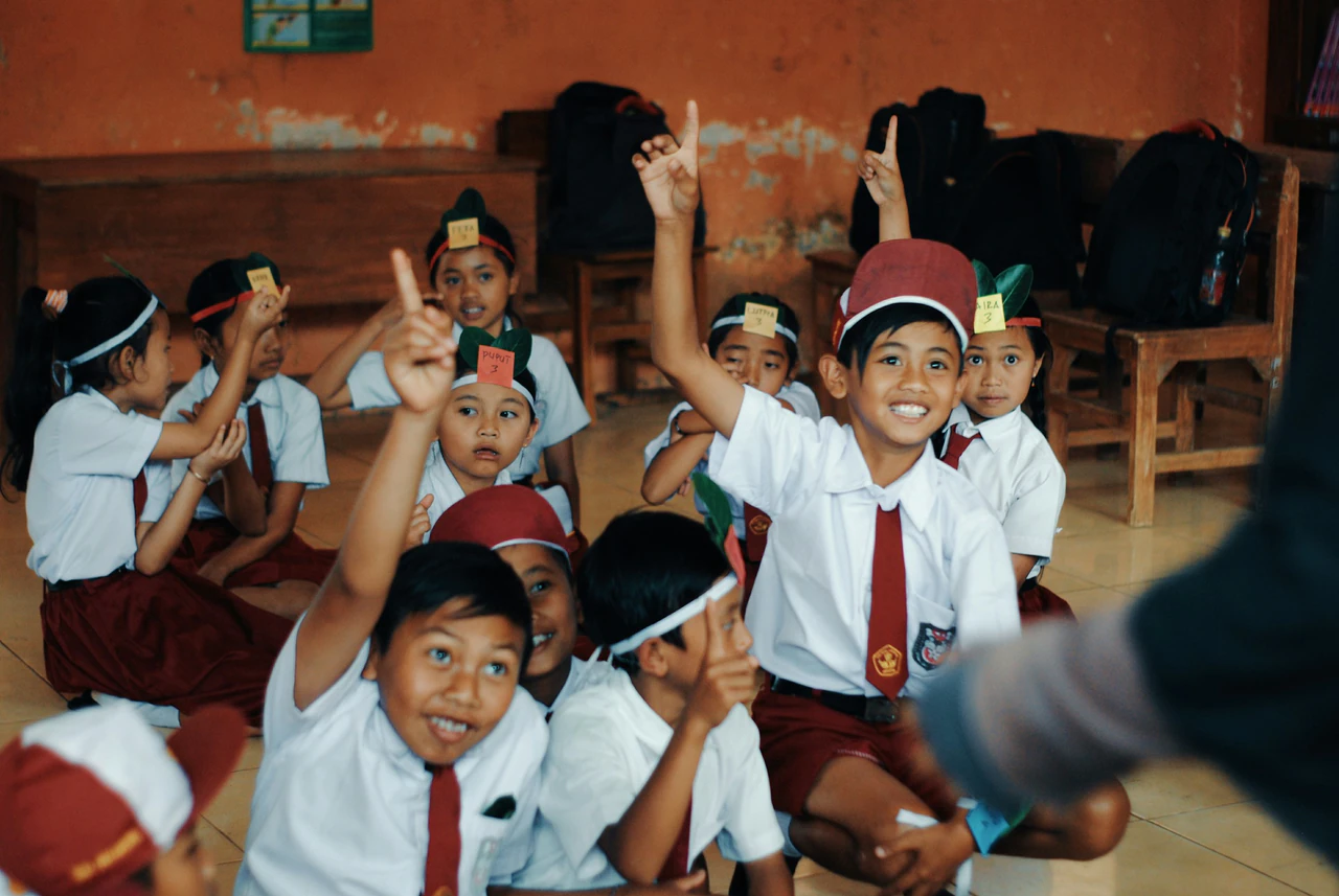 Students in a learning environment, illustrating education and participation.